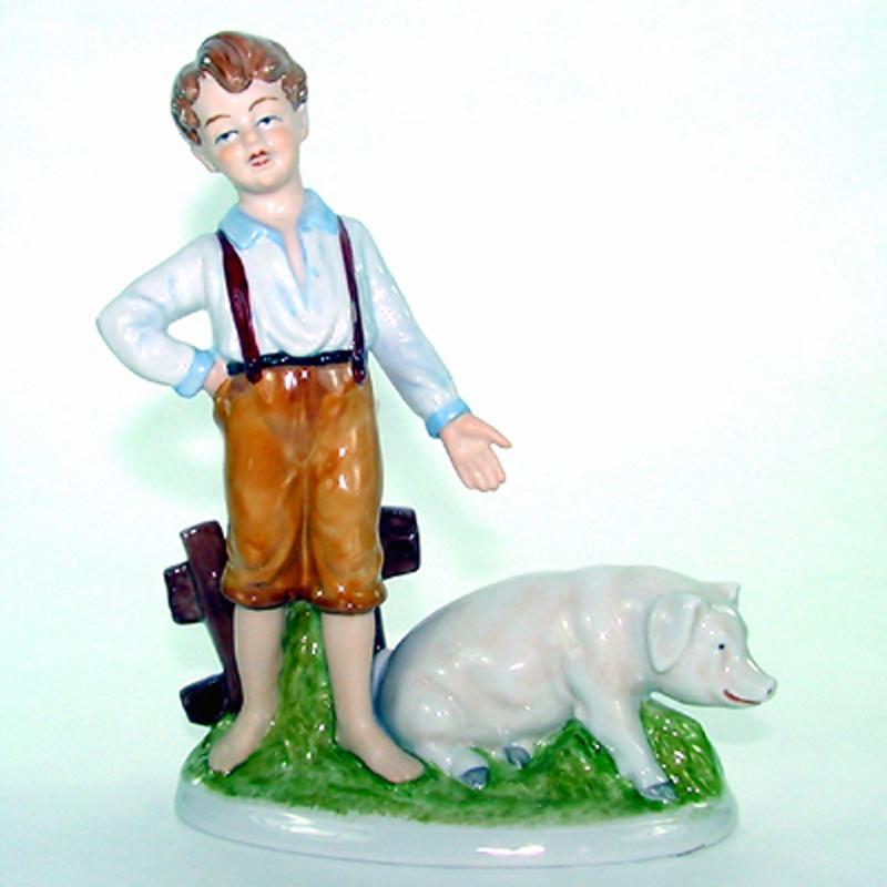 Junge mit Schwein Porzellan H 22 cm