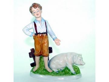 Boy with Pig - porcelain H 22 cm
