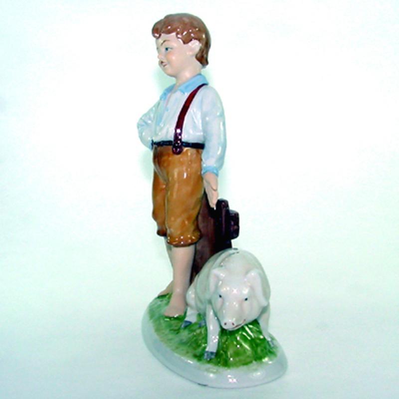 Junge mit Schwein Porzellan H 22 cm