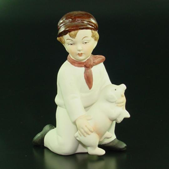 Sitting Boy with Pig china/porcelain, 11 cm